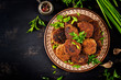 Juicy delicious meat cutlets on a dark table. Russian cuisine. Top view