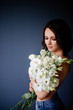 © Alina Kulbashnaia - Beautiful girl with a bouquet flowers.