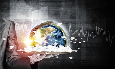 Wall Mural - Hand of waitress presenting Earth globe on tray.
