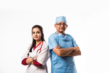 Indian/asian male surgeon and doctor/ medical practitioner standing together, isolated over white background