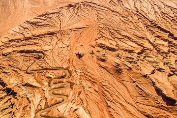 Wall Mural - The Flaming Mountains are barren eroded red sandstone hills in Tian Shan Mountain range Xinjiang China. 