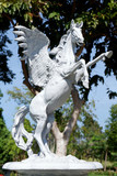 Fototapeta Paryż - Large White Horse Statue Isolated in the City Park