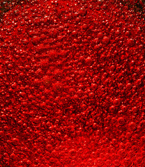 Wall Mural - Huge quantity of red air bubbles in liquid.