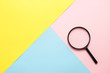 © KsPhoto - Magnifier on colored paper. Top view. Search concept