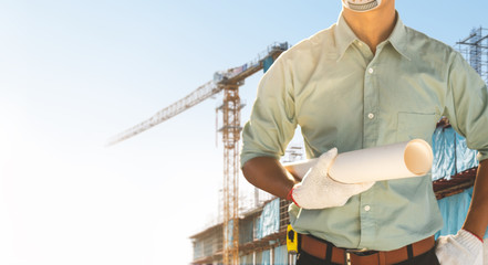 Engineers are checking the structure of the building in the construction site.