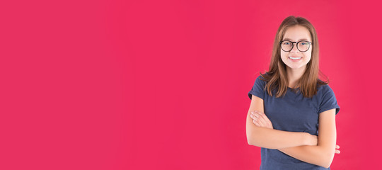 Portrait of happy funny teen girl over red background