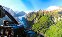 View From The Cockpit Of A Helicopter As It Flies Over The Fox Glacier On New Zealand's South Island.