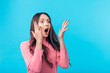 © GVS - Shocked amazing woman isolated on blue background