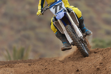 Rider driving in the motocross race the rear wheel motocross bike