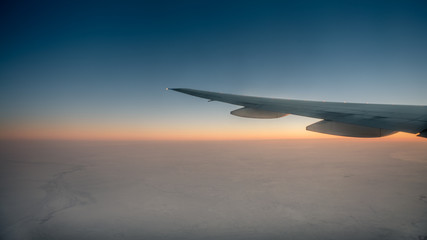 Wall Mural - wonderful view of the twilight sky through the window an airplane