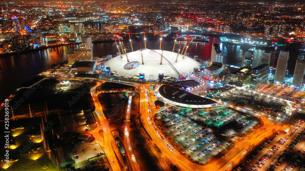 Aerial night shot from iconic O2 Arena in Greenwich Peninsula - obrazy, fototapety, plakaty 