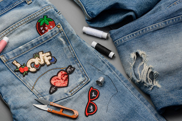 patches, threads, scissors and jeans