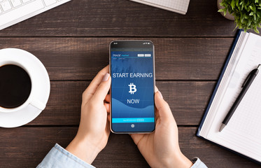 Poster - Bitcoin earning application on smartphone screen in female hands