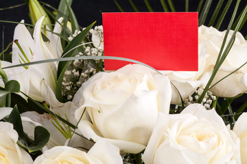 Wall Mural - Red card in a bouquet of white roses