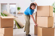 © Elnur - Middle-aged woman moving to new flat