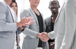 © ASDF - two happy smiling businessmans shaking hands
