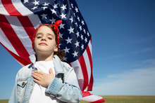 Portrait Of Proud Girl With American Flag