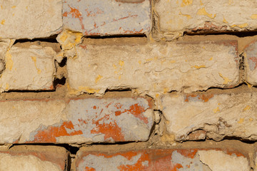 Burnt brick. Wall with rough brickwork.