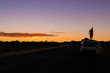 © Martin - young man standing on car while a nice Sunset in the Outback of Australia, northern terrotory