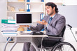 © Elnur - Young handsome employee in wheelchair at the office