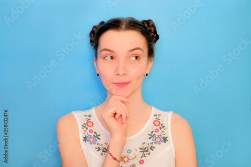 Fotografía Funny cute girl on a blue studio background