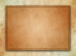 An abstract design concept of a framed, dark brown parchment texture over a stone texture background. 