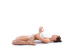 © BestForYou - Health, sport and yoga concept - sporty woman doing relax exercise on the floor isolated.