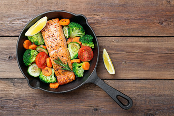 Wall Mural - Baked salmon fillet with broccoli and vegetables mix.