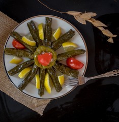 Wall Mural - traditional Turkish dishes with olive oil leaves and stuffed peppers