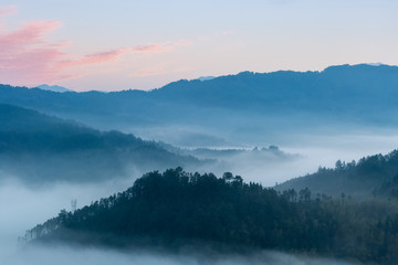 Sticker - rosy clouds and misty blue mountains