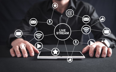 Wall Mural - Man with tablet. Live stream concept