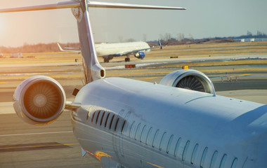 Wall Mural - jet engine against a plane at the airport on loading