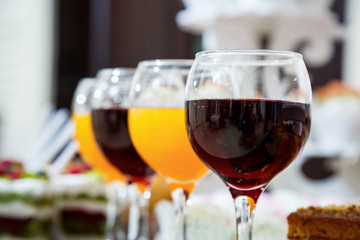 glass goblets with red and orange juice