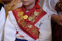 Girl Dressed In Traditional Regional Folk Costumes In The Church At The Mass On Thanksgiving Day In Stitar, Croatia