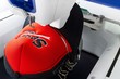 Embroidery machine and embroidered red cap close up picture