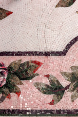 Detail of a beautiful marble mosaic panel. Interior marble mosaic. A piece of marble Venetian mosaic as a decorative background .. Selective focus