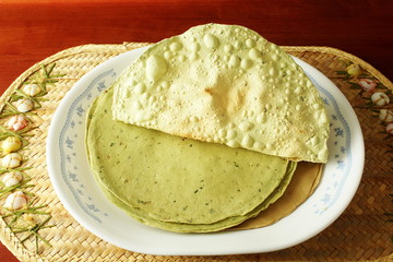 indian traditional food lunch or tea time snack papad or papadum roasted and raw dried