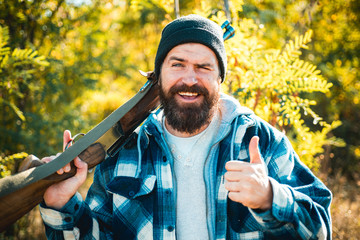 Wall Mural - Happy Hunting in forest. Closed and open hunting season. Hunter with shotgun gun on hunt. Portrait of hamdsome Hunter.