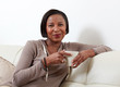 © grinny - African-American woman drinking tea.