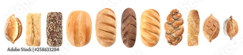 Fotografía Set of fresh bread on white background, top view