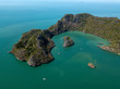 Aerial view of island in sea. Boat float near the island. Park Kilim Geforest, Langkawi, Malaysia.