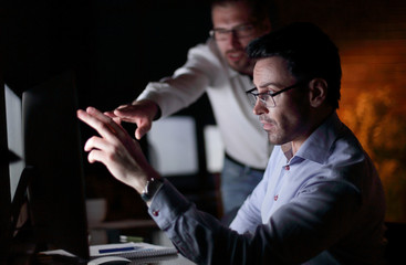 businessman working with documents dark office