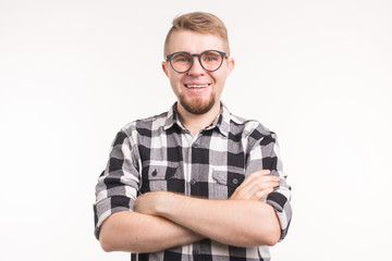 People, portrait and education concept - Smiling student man in plaid shirt over white background