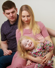 Family couple on a black background. Studio portrait.