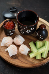 Wall Mural - Wooden serving tray with chinese steamed prawn hargows, vertical shot, closeup