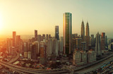 Fototapeta Na sufit - Future 3d modern neon light design skyscraper mix in sunrise Kuala Lumpur city skyline , future vision of modern city , mixed media .