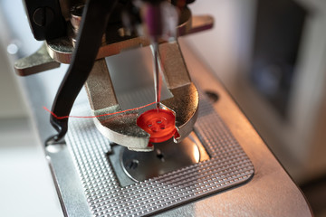 Fastening sewing machine close-up. Modern textile industry.