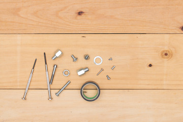 Working tools on wooden background - top view.