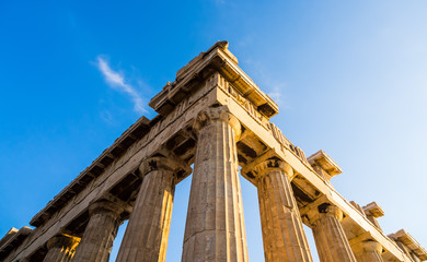 View of corner of Parthenon and its columns on Acropolis, Athens, Greece against blue sky