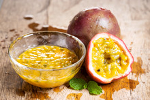 Ripe Passion Fruit And Passion Fruit Juice On Wooden Background